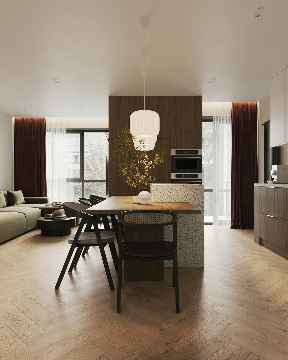 Modern open-plan living, dining, and kitchen area with herringbone floors.
